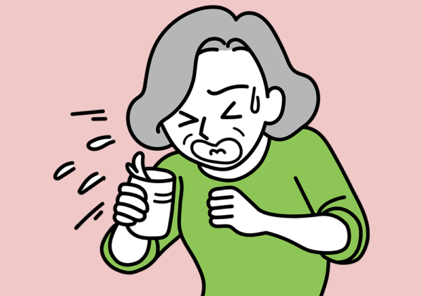 むせる高齢女性